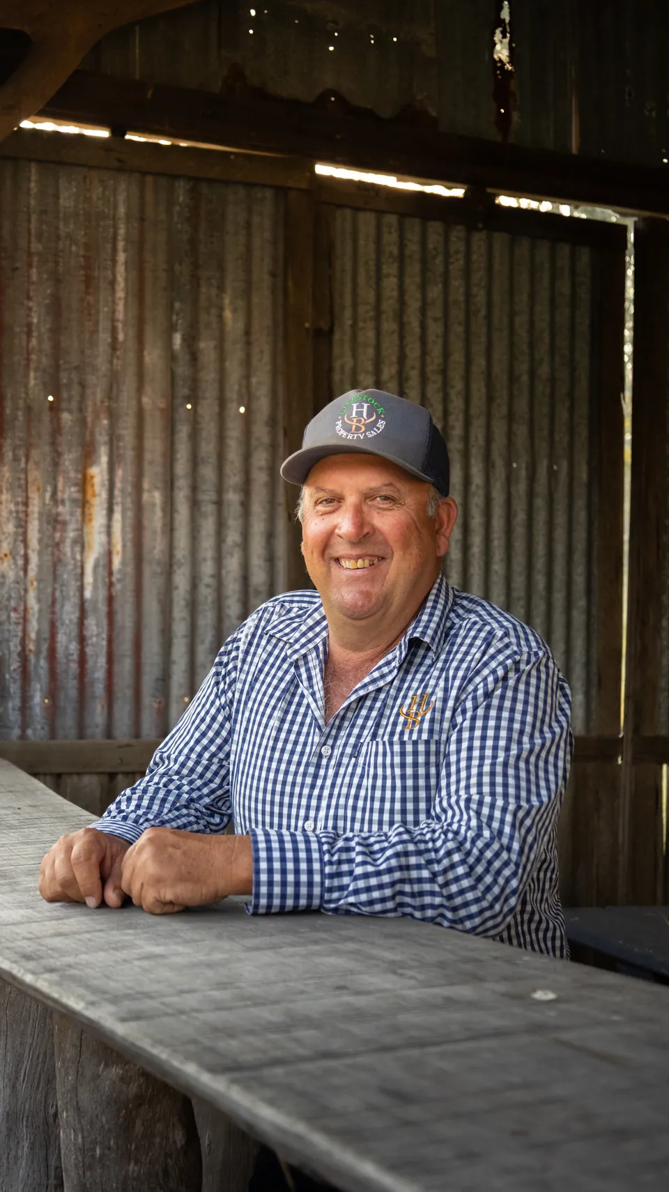 Rural business owner photographed at a workbench on his property