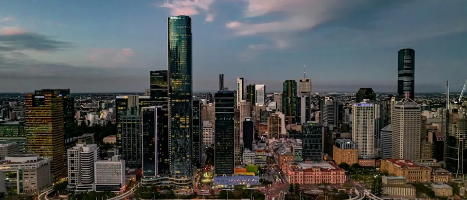 The Brisbane CBD skyline at dusk, seen across the Brisbane River
