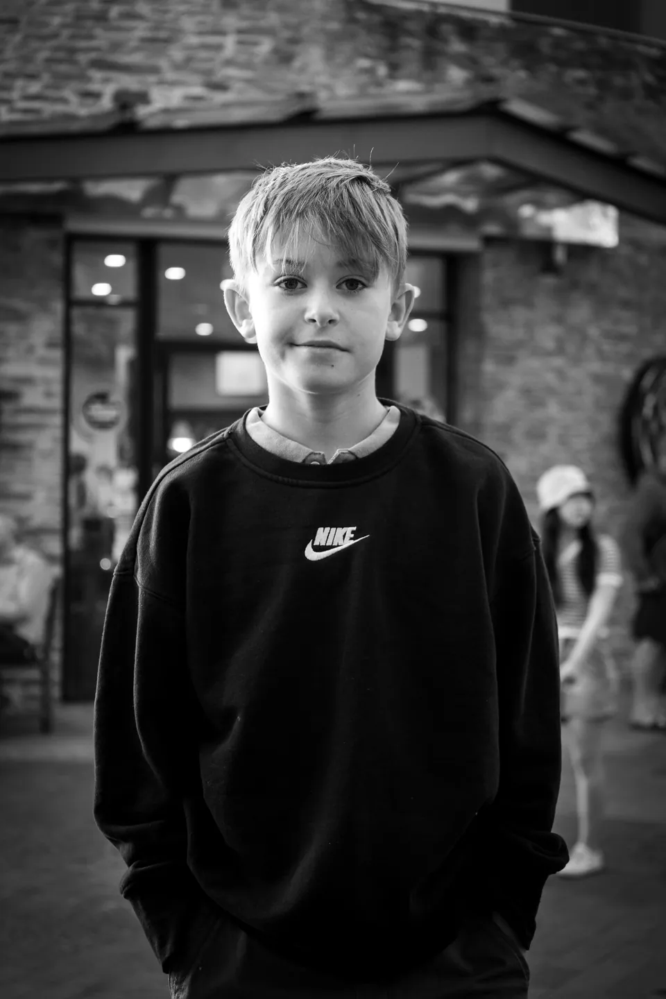 Black and white street portrait of a young person