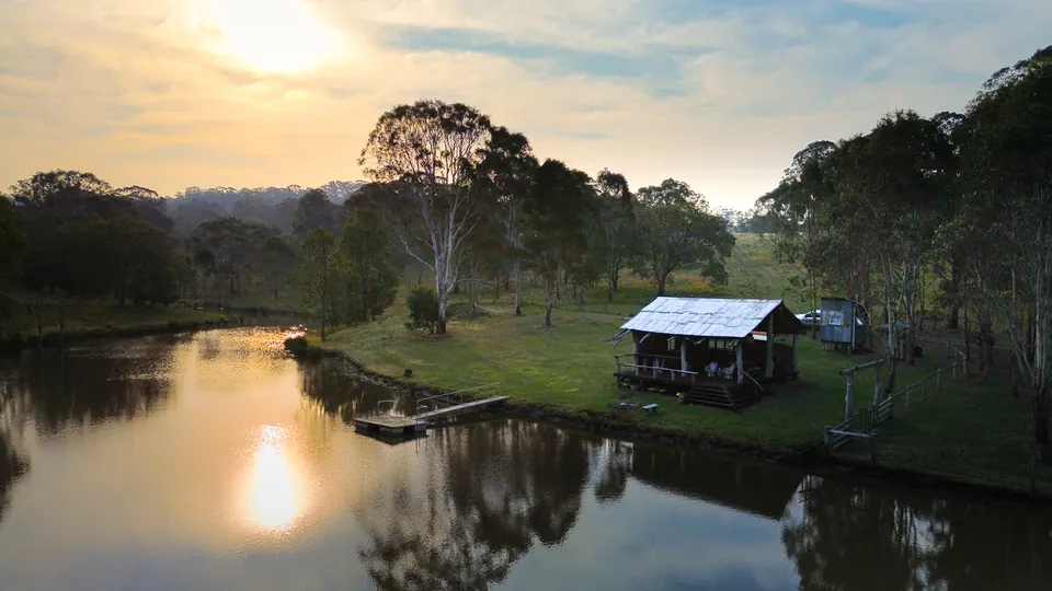 Dusk over the dam at 440 Palmtree Road, a rural property filmed by Wave Creative